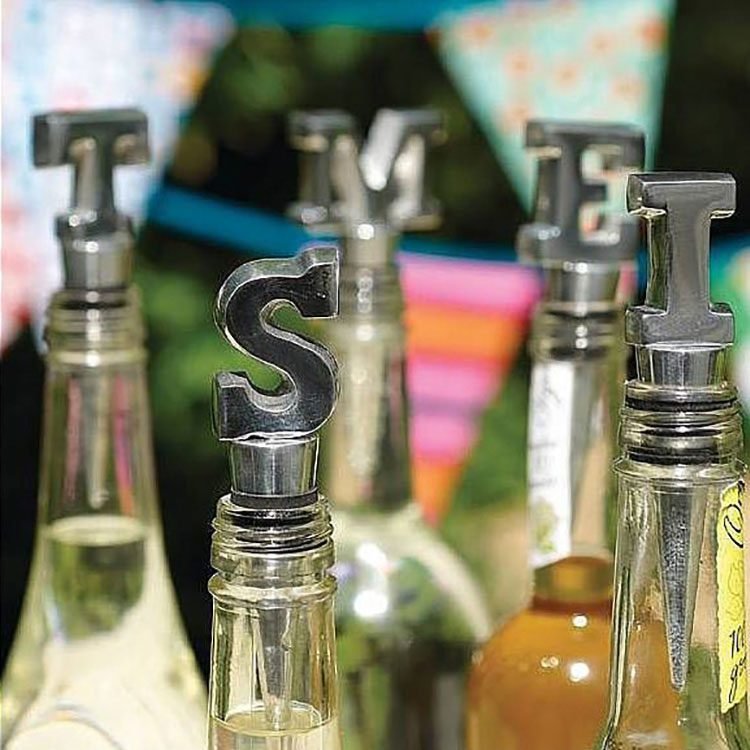 Letter-shaped wine bottle stoppers